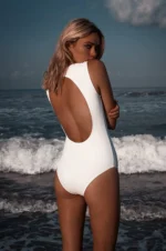 open scale one piece swimsuit with metal clutch